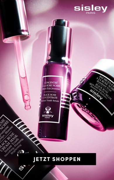 "Sisley Paris Black Rose Pflegelinie mit Serum, Maske und Creme in dunklen Flakons auf rosigem, flüssigem Hintergrund, mit Button ‘Jetzt shoppen’.